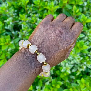 Blush Pink Recycled Glass Bracelet: Handcrafted eco-friendly jewellery made from recycled glass. Delicate pink beads on a wrist. Sustainable fashion accessory.